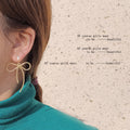 Gold Textured Wire Long Tail Bow Stud Earrings Pair view 2