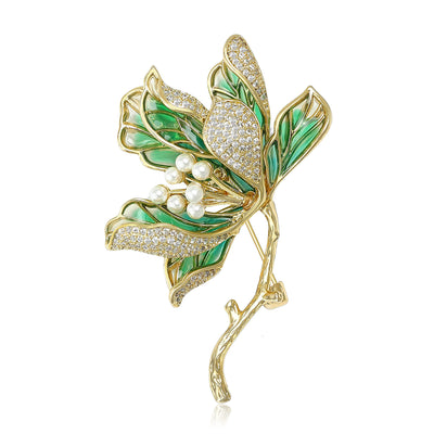 Front view of enamel Leaf Floral Branch Brooch With Pearls in Green or Purple against a white background.