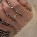 Gold Tone Three Piece Crystal Heart Wave And Textured Ring Set view 4