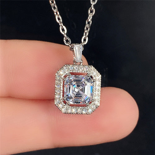 front view of silver-tone necklace with a rectangular clear double-halo pendant