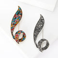 Curved Crystal Leaf Brooch In Black And Multicolor Finishes view 1