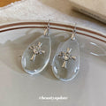 Clear Teardrop Hook Earrings With Silver Cross Charms view 2