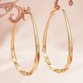 Brass Gold-Tone Twisted Teardrop Hoop Earrings in Three Sizes view 5