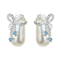 Silver Tone Bow White Potion Bottle And Blue Stone Stud Earrings view 5