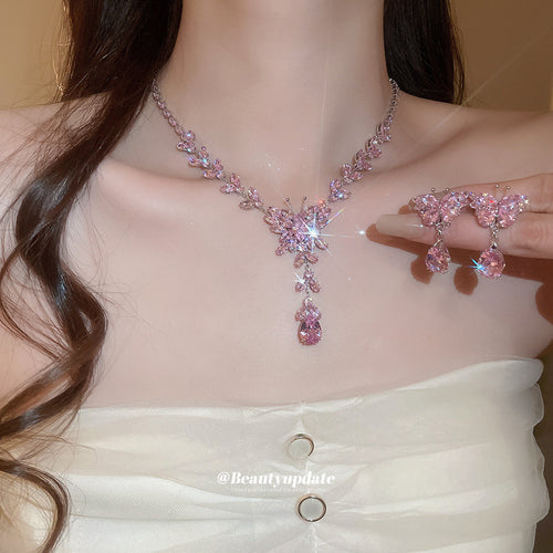 butterfly crystal tassel necklace and earring set in pink or clear shown worn in a styled second view