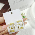 Clear Resin Dried Flower Gold Rim Hoop Earrings 2 Colors view 4