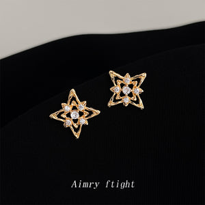 Gold Openwork Starburst Cubic Zirconia Stud Earrings