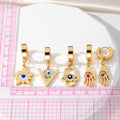 Gold Tone Evil Eye Hamsa and Star Huggie Drop Earrings view 4