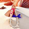 Pearl Loop Mini Mermaid Keychains in Three Sitting and Reclining Poses view 4