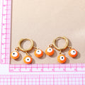 Gold Tone Triple Evil Eye Bead Huggie Drop Earrings in Five Colors view 4