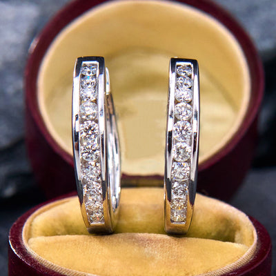 Front pair silver channel set CZ hoops in jewelry box on slate