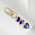 Gold Tone Evil Eye Charm Keychain with Blue Tassel and Rhinestone Accents view 6