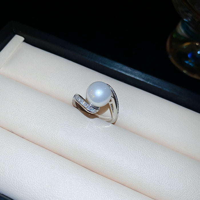 Silver Tone Pearl Like Open Ring With Curved Baguette Crystal Row