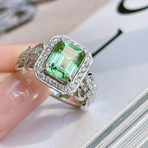 Second product view showing silver-tone green rectangular halo cluster ring