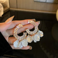 White Floral Shell and Pearl Drop Earring Collection view 6