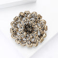 Openwork Round Floral Crystal Brooch in Antique Gold Tone view 4