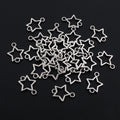 Small Star Charms in Four Distinct Open and Solid Shapes view 2