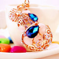 Jeweled Gourd Keychain With Blue Faceted Stones and Openwork Frame view 1