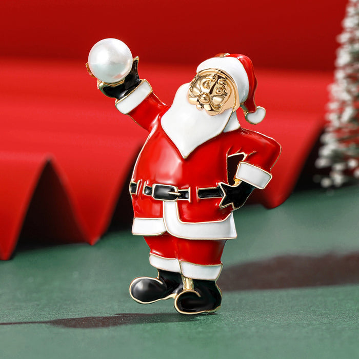 Red Enamel Santa Brooch Holding a White Pearl-Like Ball