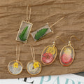 Gold Tone Clear Resin Pressed Flower and Leaf Hook Earrings view 1