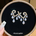 Crystal Scroll Drop Earrings in Gold and Silver Tone Options view 3