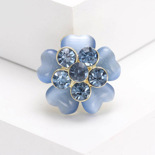 Angled display showing the brooch color and crystal details