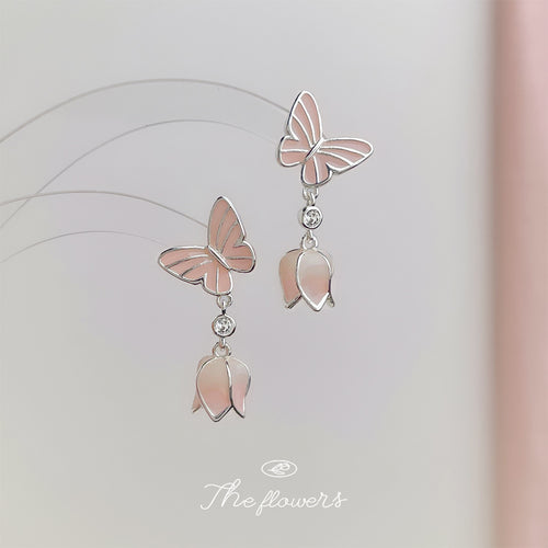 Silver-tone pink-butterfly flower-drop studs in the first product display.
