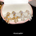 Bow Pearl Drop Stud Earrings In Silver And Gold Tones view 2