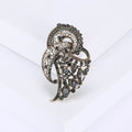 Gray Crystal Feather Brooch with Polished Metal and Decorative Accents view 1