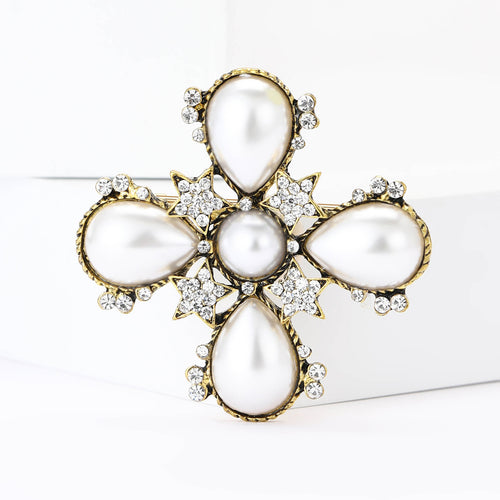 Gold pearl cross brooch front close-up star accents