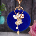 Wooden Love Heart Rabbit Fur Pom Keychains in Fifteen Pictured Fur Colors view 3