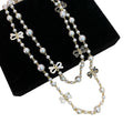 Black and White Bow Charm Long Pearl Strand Necklace view 5