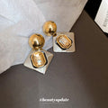 Gold and Silver Tone Geometric Drop Earrings With Amber Crystals view 3
