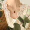 Red Oval Pendant Necklace Gold and Steel Frame Chain view 7