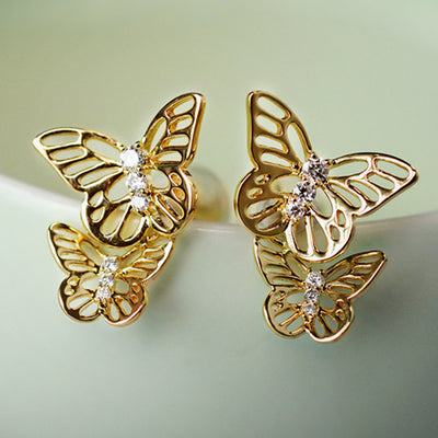 Double butterfly stud earrings in front product view