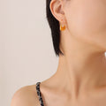Gold Steel Crescent Bag Shape Textured Hoop Earrings view 6