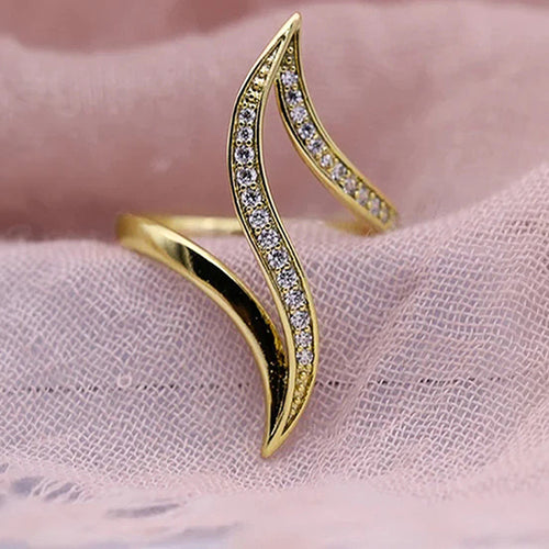 Second product view showing gold-tone long double-leaf clear-stone open ring