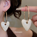 Gold Tone Hoop Earrings with Resin Heart Drops in Three Colors view 3
