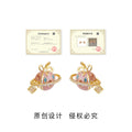 Gold Tone Pink Planet Bow And Clear Stone Stud Earrings view 3