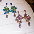 Faceted Crystal Floral Drop Stud Earrings with Polished Metal Tone Details view 2