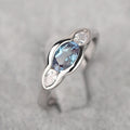 Blue Oval And Clear Round Three-Stone Ring In Silver Tone view 1