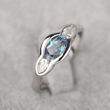 Blue Oval And Clear Round Three-Stone Ring In Silver Tone