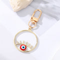 Gold Tone Irregular Openwork and Lash Evil Eye Clip Keychains view 3
