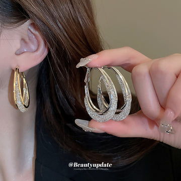 Textured Oval Hoop Earrings In Gold And Silver Tones