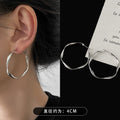Twisted Metal Hoop Earrings In Three Sizes And Colors view 2