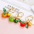 Leaf, Persimmon and Orange Charm Keychains in Three Pictured Colors view 2