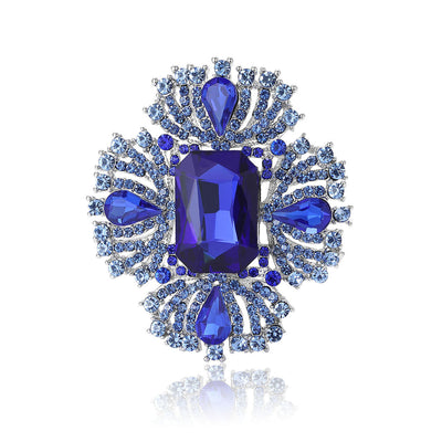 Front view of radiating crystal cluster around a large rectangular center stone