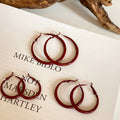 Red Textured Wavy Hoop Earrings in Two Sizes with Detailed Finish view 4