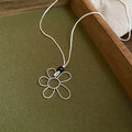 Silver Flower Pendant And Baroque Pearl Cord Necklaces view 6