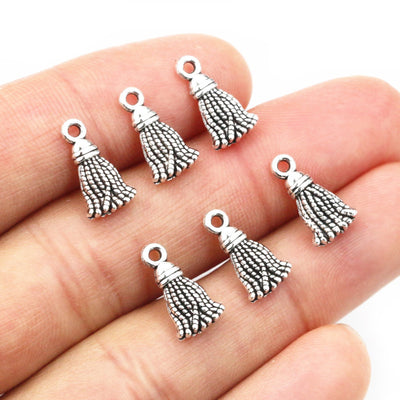 small sculpted tassel charm assortment on a light background